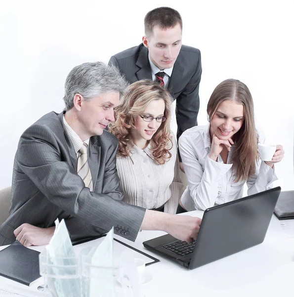 Business team discussing business issues sitting behind a Desk Royalty Free Stock Images