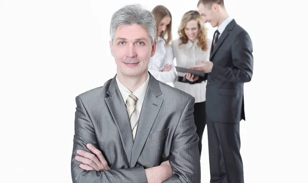 Portrait of successful businessman on background of employees — Stock Photo, Image