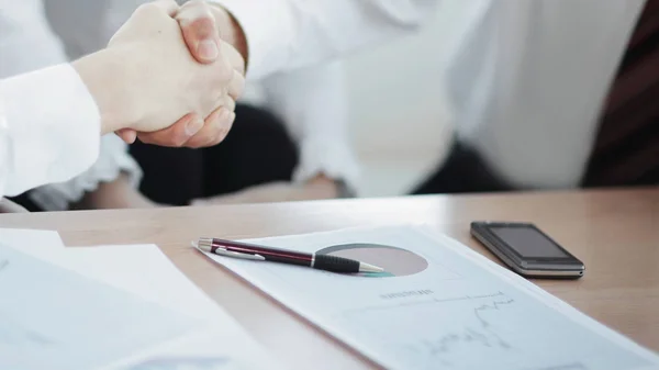 Closeup.the financial partners shaking hands over Desk — Stock Photo, Image