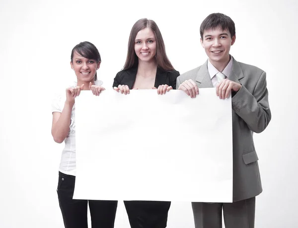 Equipe de negócios bem sucedida segurando um banner em branco . — Fotografia de Stock