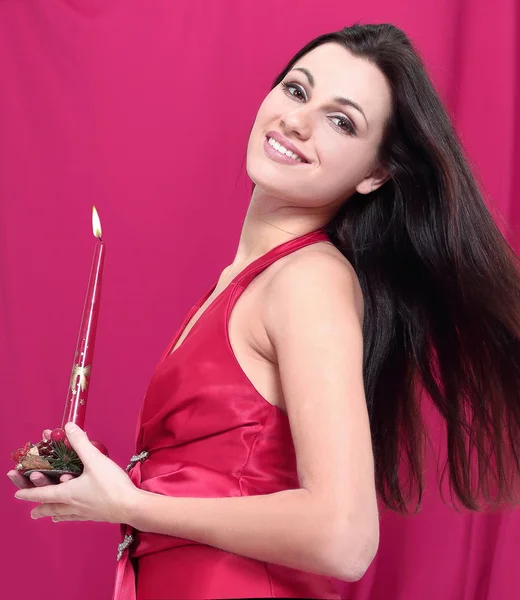 Closeup . a young woman with a Christmas candle — Stock Photo, Image