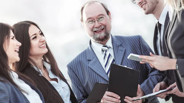 Closeup of the boss and business team on office background — Stock Photo, Image