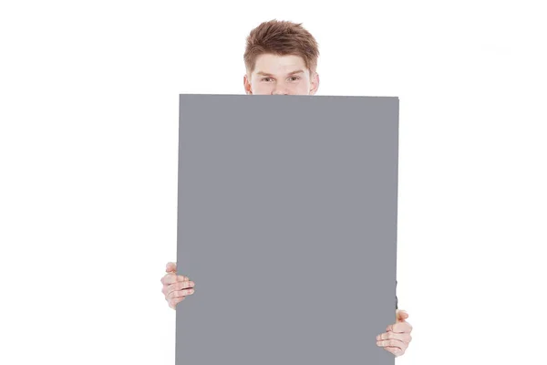 Mladý podnikatel ukazuje prázdnou placard.isolated na bílé — Stock fotografie