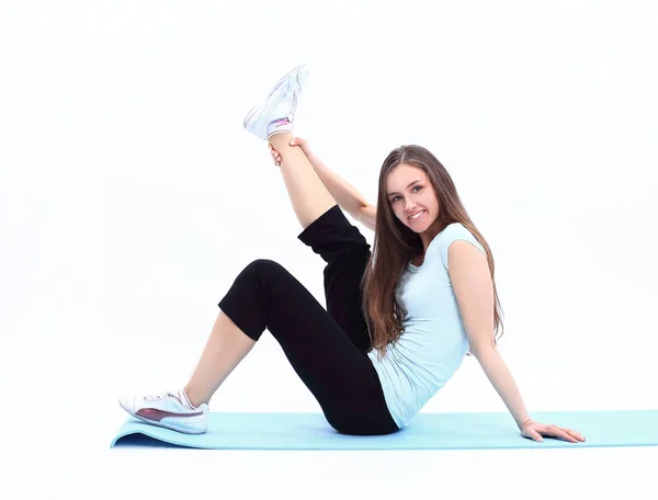 Sportowy młoda kobieta robi ćwiczenia rozciągające mięśnie . — Zdjęcie stockowe