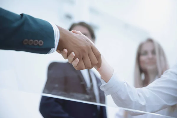 Bottom view .handshake business women with a business partner — Stock Photo, Image