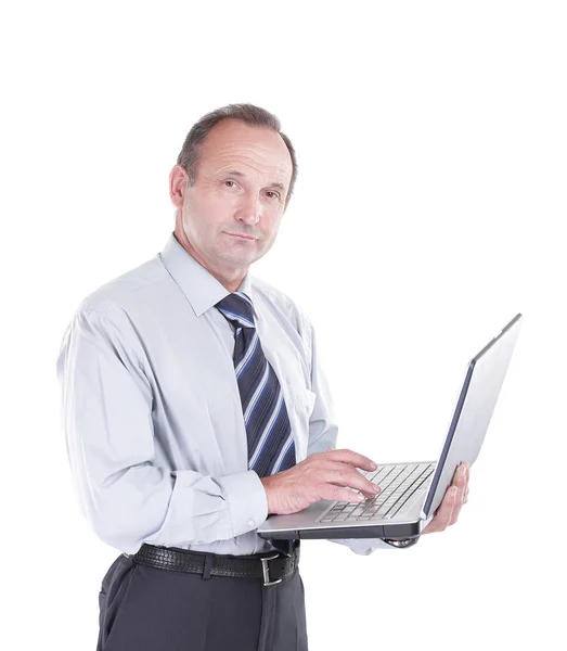 Serious businessman with an open laptop — Stock Photo, Image