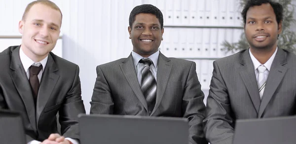 Business partners sitting at your Desk in the office — Stock Photo, Image