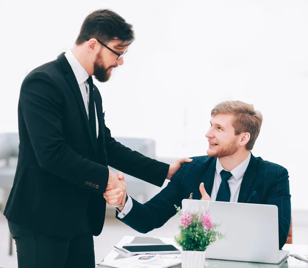 handshake Manager and employee in the workplace
