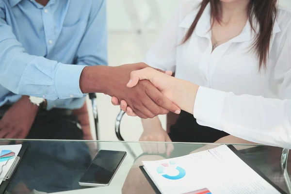 Closeup.the financial partners shaking hands over a Desk. — Stock Photo, Image