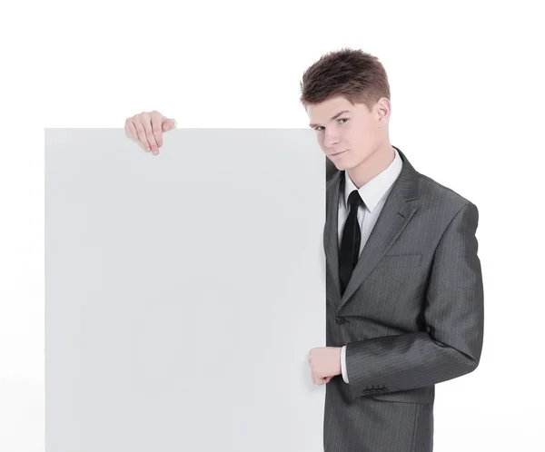 Exitoso joven hombre de negocios mirando banner en blanco — Foto de Stock