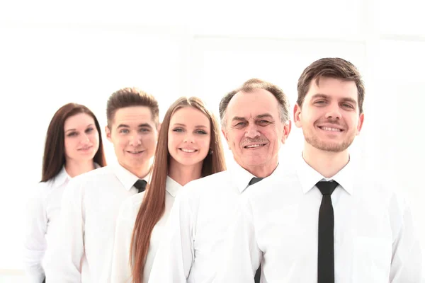 Close up. boss and confident business team standing in a row — стоковое фото
