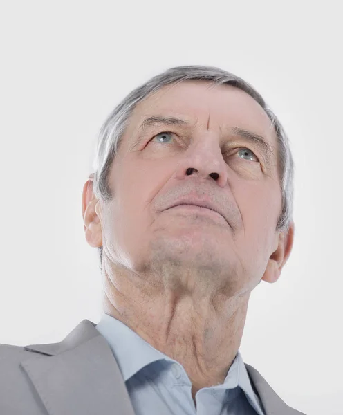 Closeup.confident senior businessman looking up at copy space — Stock Photo, Image