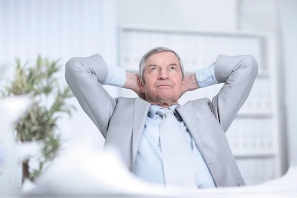 Senior businessman dreaming of sitting at his Desk — Stock Photo, Image