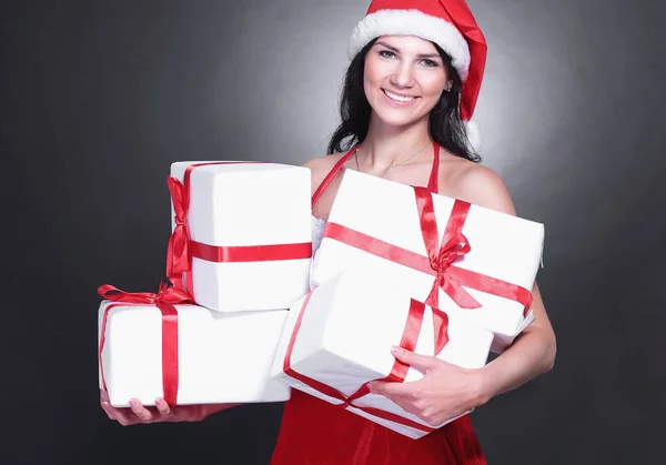 Happy young woman in costume of Santa Claus with lots of Christ — Stock Photo, Image