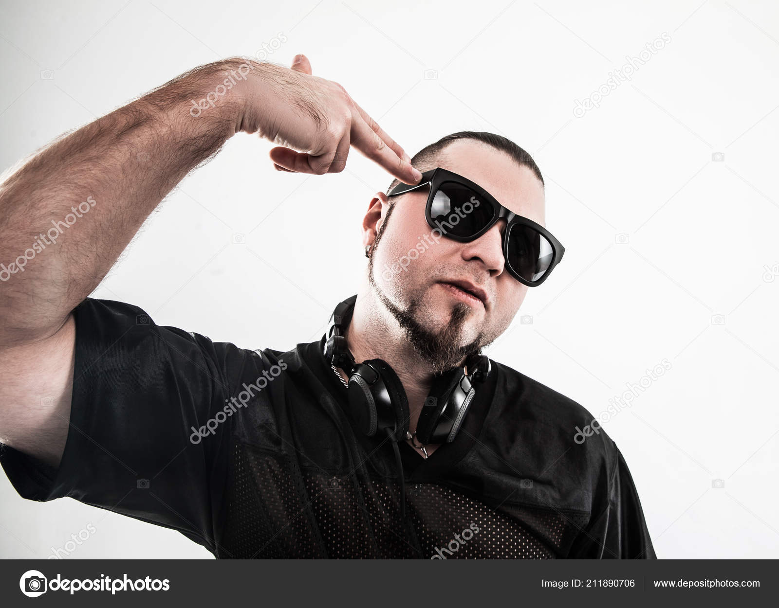 of a badass rapper in sunglasses with on a w Stock Photo by ©albertyurolaits 211890706