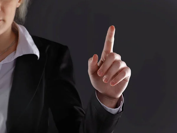 Close up.business woman showing index finger up.isolated on black background — Stock Photo, Image