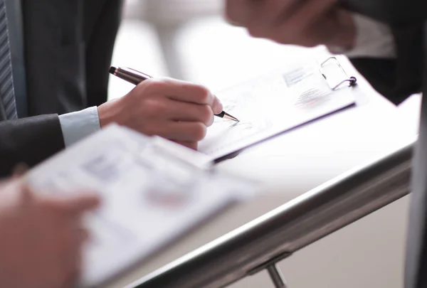 Close up of business people hands pointing growing financial bu — Stock Photo, Image