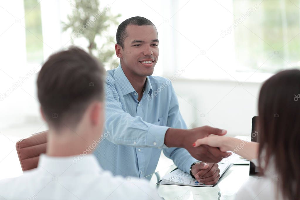 closeup.handshake Manager and the client in the office.the concept of cooperation