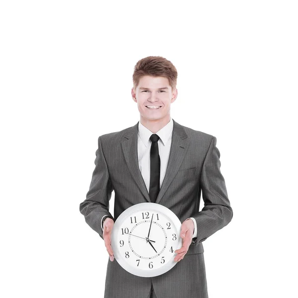 Homem de negócios bonito segurando um grande relógio. Isolado em um branco — Fotografia de Stock