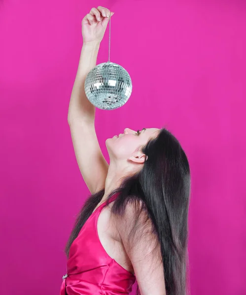 Stylish young woman with a mirror ball — Stock Photo, Image