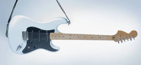 Primer plano .modern guitarra eléctrica sobre un fondo blanco . — Foto de Stock