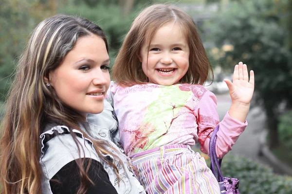 Happy mother and little daughter on a walk — Stock Photo, Image