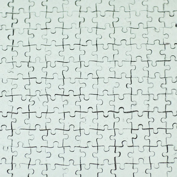 Close up. blank card collected from puzzle pieces on gray backgr — Stock Photo, Image
