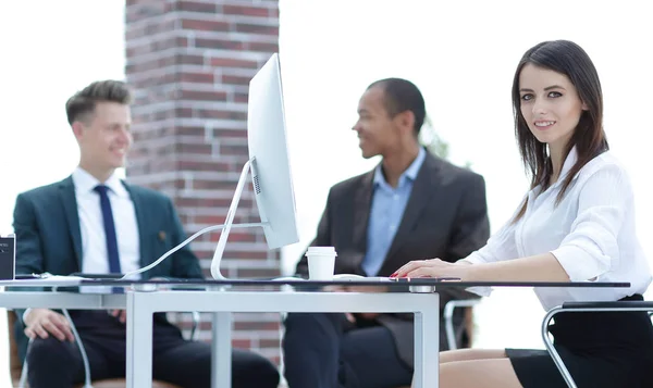 Executive business woman in office on the background of business team