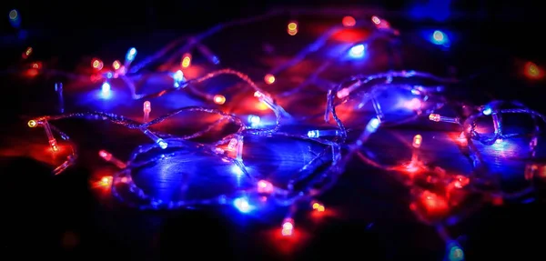 Festive background.blurred colored lights on a black background — Stock Photo, Image