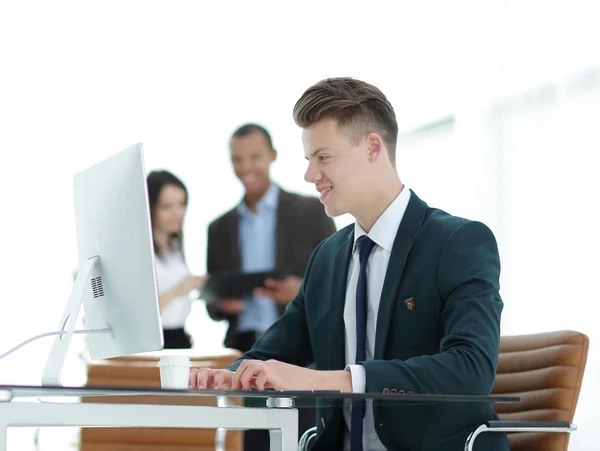 Employee sitting behind a Desk in the office . — Stock Photo, Image