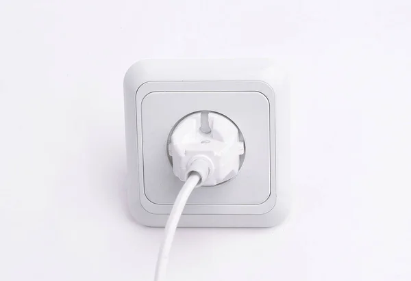 Plug into an electrical outlet.isolated on a white background. — Stock Photo, Image