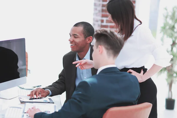 business team discussing work problems sitting at their Desk