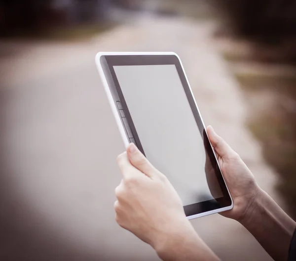 people and technology .closeup of person holding digital tablet