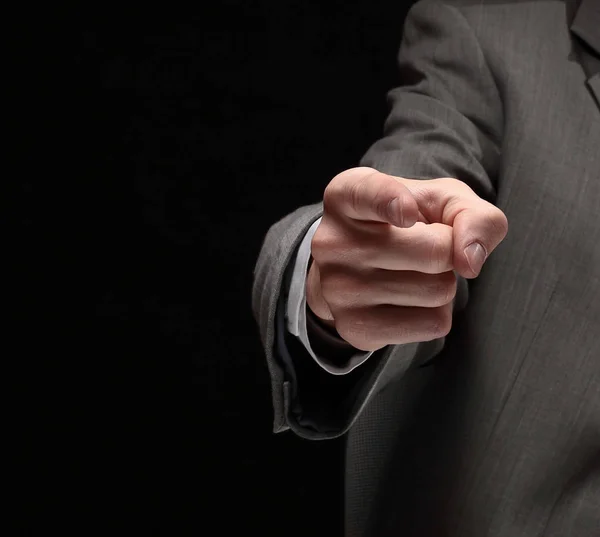 Closeup. businessman pointing at a copy space while sitting at — Stock Photo, Image