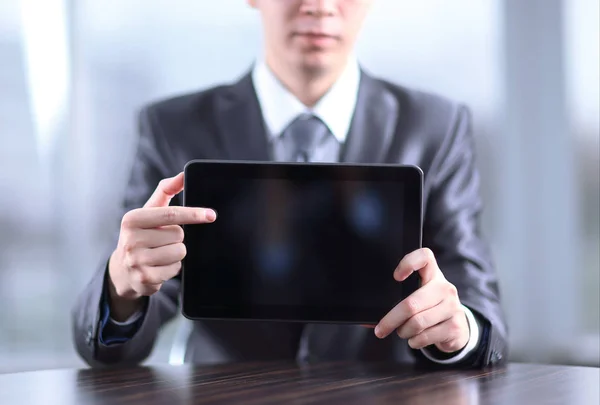 Close up.handsome businessman pointing at digital tablet screen — Stock Photo, Image