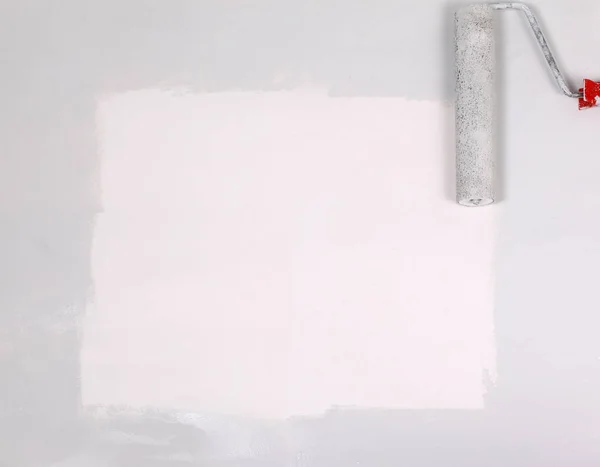 Square painted white with the paint roller, on a white sheet of — Stock Photo, Image