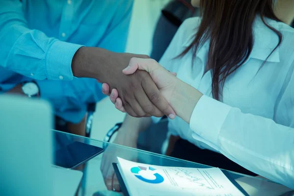 Closeup.the financial partners shaking hands over a Desk. — Stock Photo, Image