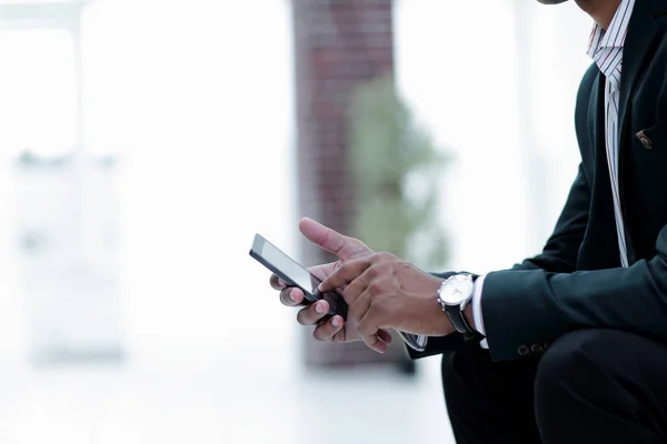 Closeup. employee typing SMS on the smartphone — Stock Photo, Image