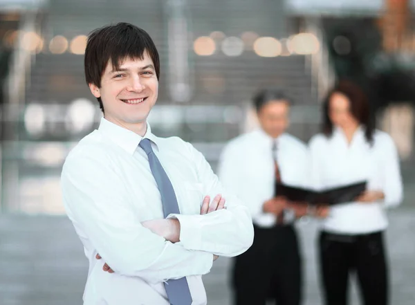Successful employee in the background of the office — Stock Photo, Image