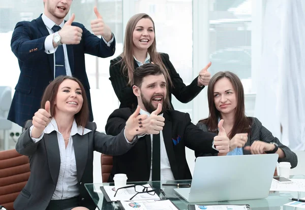 Business team with thumbs up and vote for a decision near the desktop — Stock Photo, Image