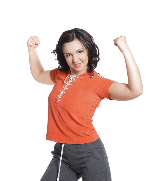 Charmig kvinna i träningsoverall som visar biceps.isolated på vit — Stockfoto