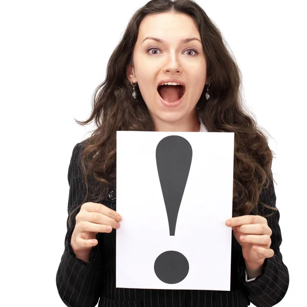 Young business woman holding the exclamation mark — Stock Photo, Image