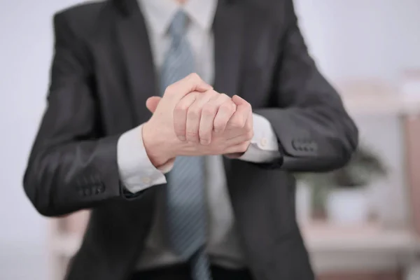 Close up.Businessman showing a gesture of friendship and unity — Stock Photo, Image