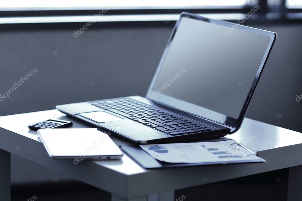 close up. laptop and financial documents on the table