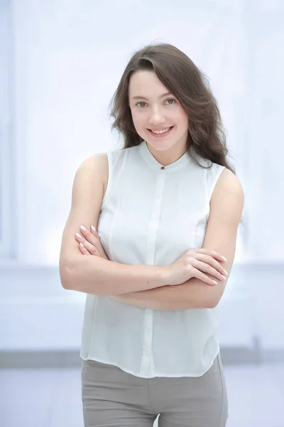 Young business woman on the background of office window — Stock Photo, Image