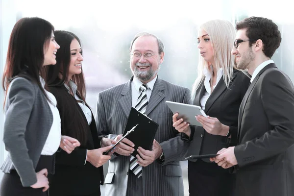 Close up.a business team standing talking in the office — Stock Photo, Image