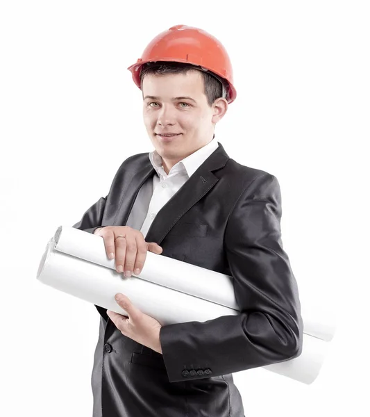 Jeune ingénieur avec des dessins en casque orangé.isolé sur blanc — Photo