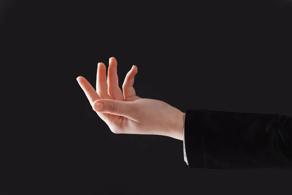 Z bliska. biznes kobieta Dokonywanie .isolated gest ręki na czarnym tle — Zdjęcie stockowe