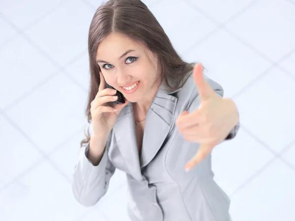 Utsikt från toppen. framgångsrik affärskvinna med en mobiltelefon — Stockfoto