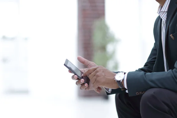 Closeup. employee typing SMS on the smartphone — Stock Photo, Image